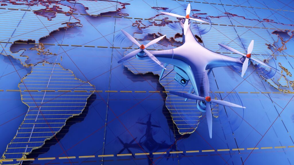 世界地図の上を飛ぶドローン