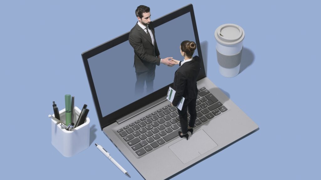  オンラインで出会い、握手を交わすビジネスマンたち