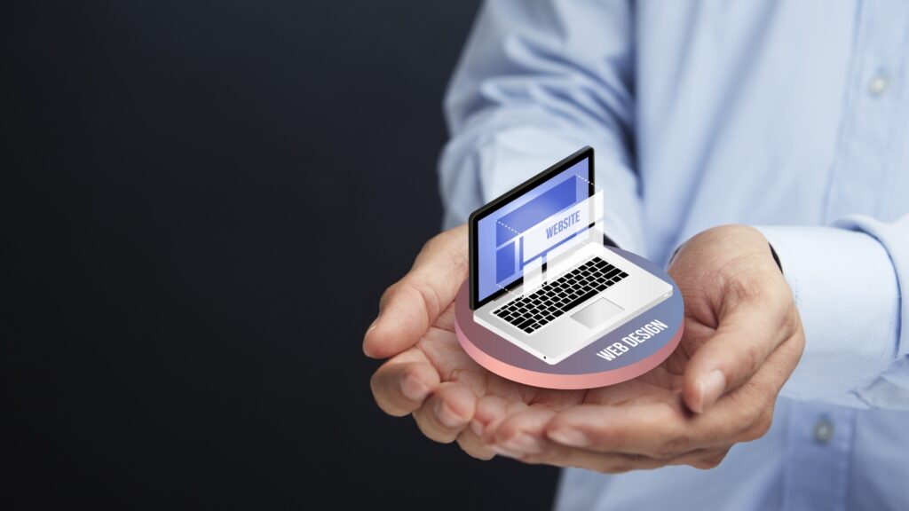 web サイトのイメージ　パソコンを持つ人の手
