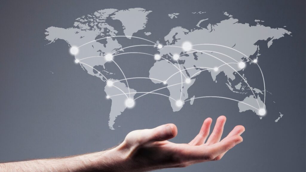 世界地図とネットワークと人の手