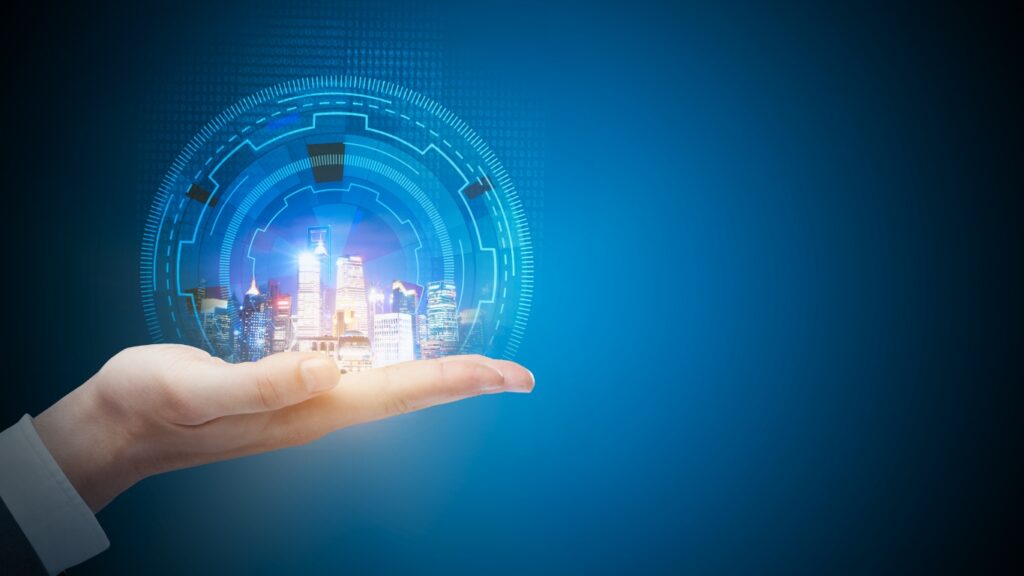 手の上に未来の街が光っている