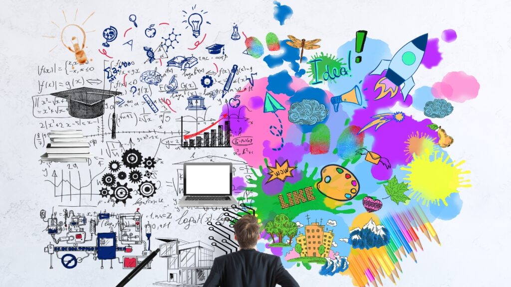 数式や色とりどりの絵を見て考えているビジネスパーソン