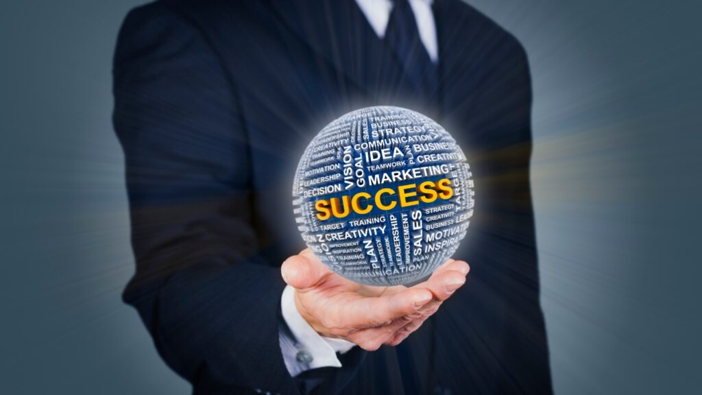 成功のボールを持つビジネスパーソン